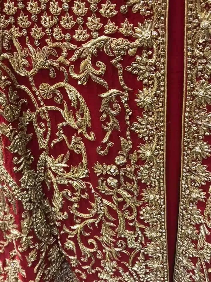 Beautiful bridal lahnga maxi in deep red color work with heavy dabka zari nagh perls and old work Model #B 1112